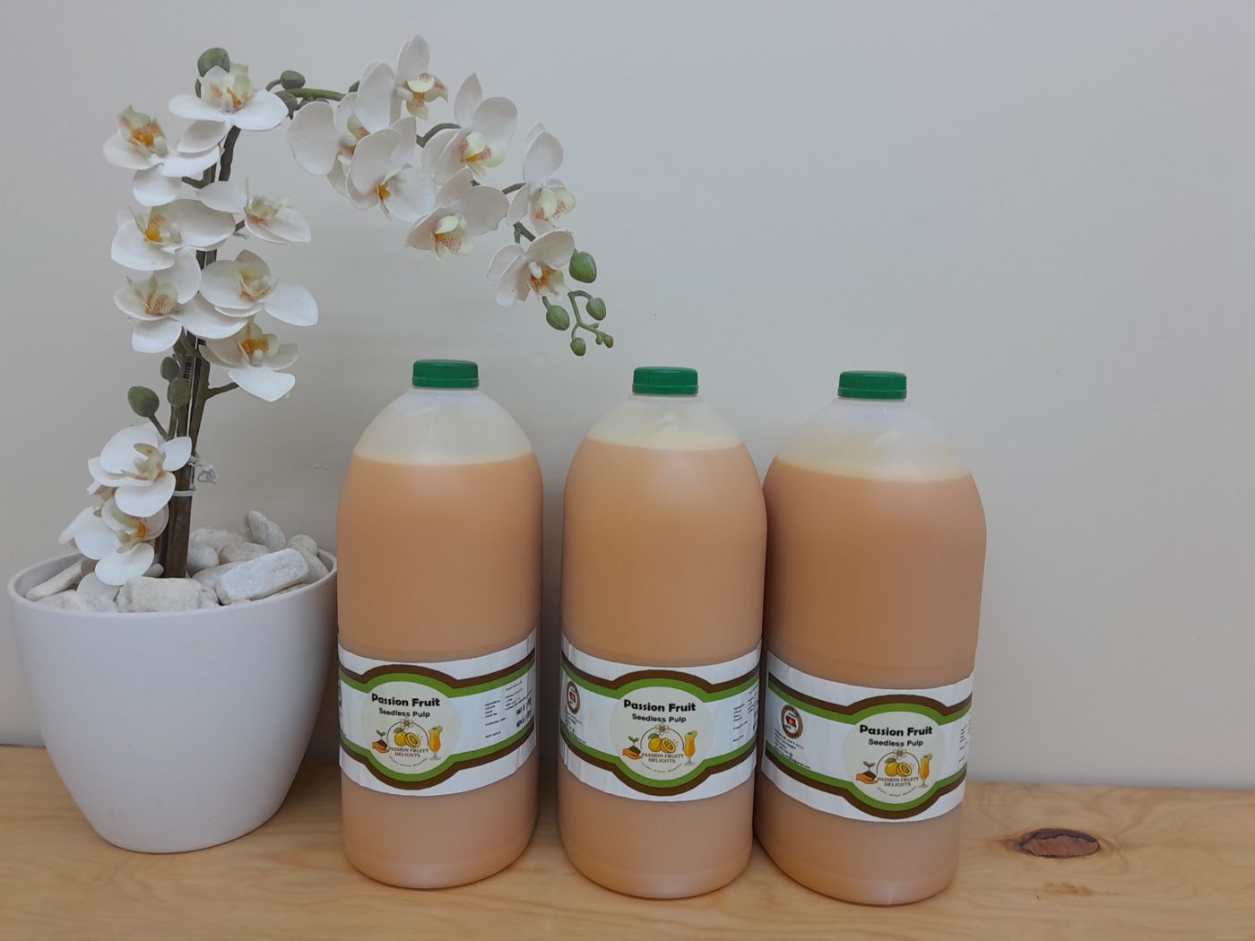 Three 4 litre bottles of Passion Fruity Delights seedless pulp